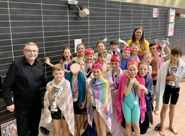 Children celebrate with councillors Chris Ready and Laura Flynn