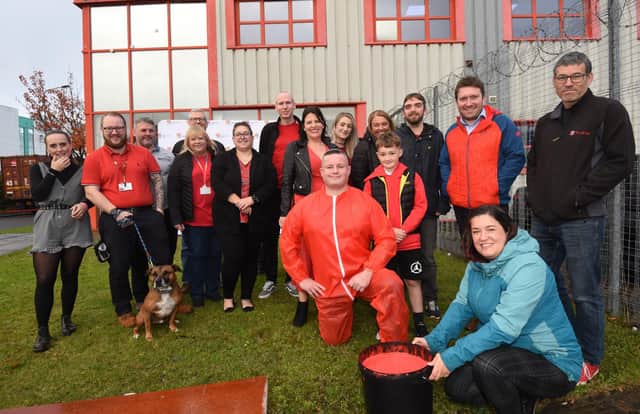 Mike Hyde, managing director at Truline Construction and Interior Services, Wigan, gets covered in red gunge, raising funds for Wigan Youth Zone, part of the Painting the Borough Red, Wigan Youth Zone fund-raising campaign.