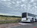 The coach is on the hard shoulder of the M6