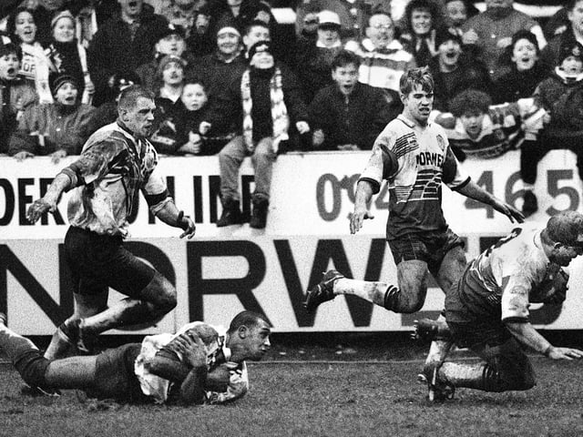 Wigan hooker Martin Hall plunges over for a try against St. Helens with Gary Connolly outside him and David Lyon and Alan Hunte unable to stop him in the Challenge Cup Round 4 match at Central Park on Saturday 11th of February 1995.
The match was a 16-16 draw.