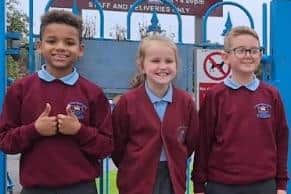 The DW Stadium seat challenge will be carried out by primary school pupil Darcey Hodge (centre) with her two friends Michael  Lythgoe and Harvey Braun