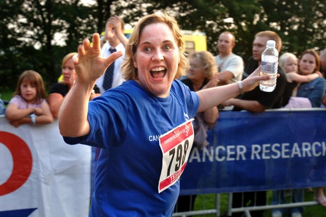 Happy finish for a runner at the Race For Life at Haigh Hall on Wednesday 28th of June 2006. 