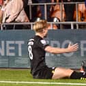 Matt Smith celebrates his goal at Blackpool on Monday night