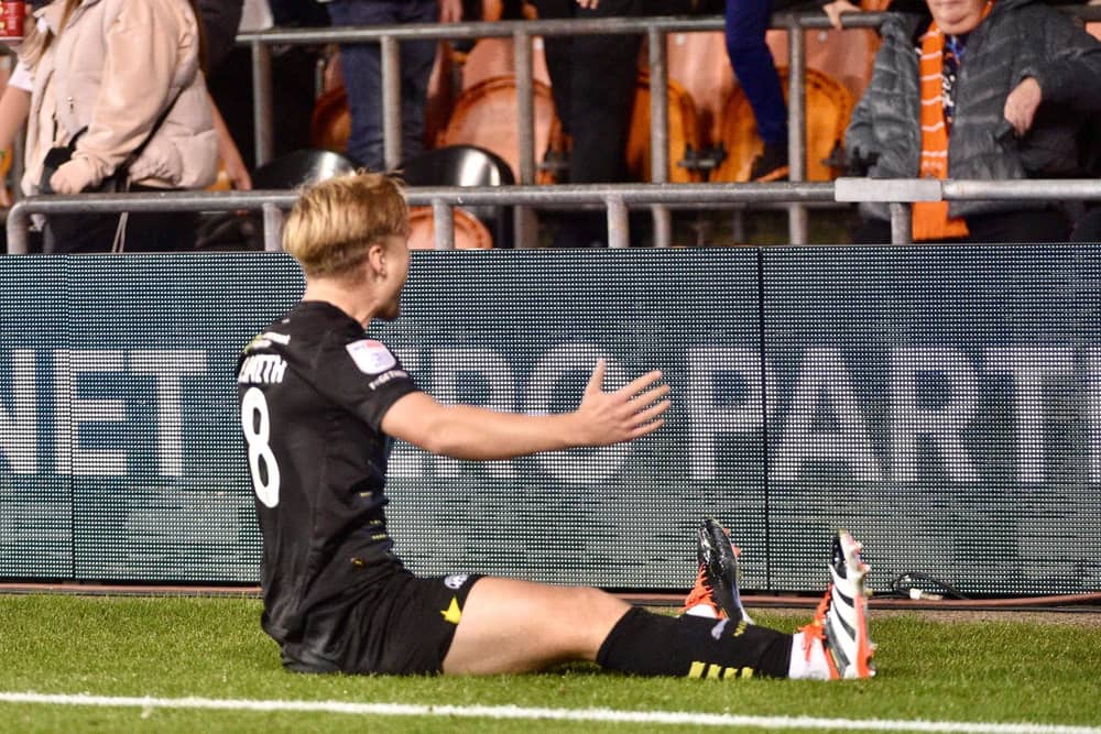 Matt Smith celebrates his goal at Blackpool on Monday night