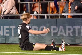 Matt Smith celebrates his goal at Blackpool on Monday night