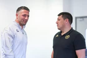 Warrington Wolves coach Sam Burgess (left) and Wigan Warriors boss Matt Peet (right) in conversation