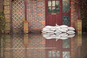 Trying to keep out flood water. Photo: Adobe