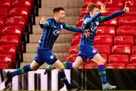 Sean McGurk (right) celebrates scoring for Latics against Manchester United at Old Trafford in the FA Youth Cup in February 2020