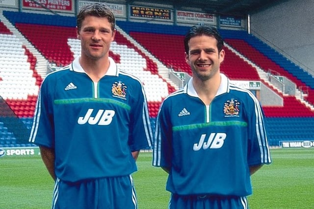 Wigan Athletic players Andy Liddel and De Zeuwe model the new kit.
