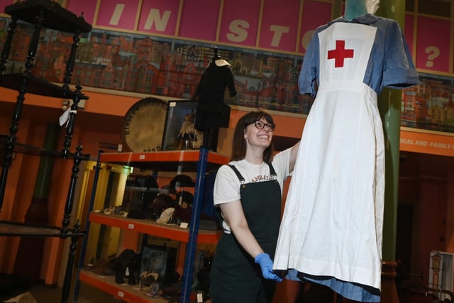 Eleanor Whitehead prepares items for the exhibition.