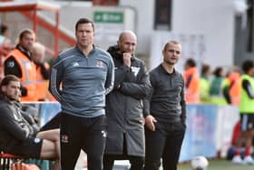 It was an unhappy reunion for Gary Caldwell as Shaun Maloney's Latics left Exeter with all three points