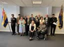 Pam Gilligan, from Compassion in Action, with veterans from the Wigan borough