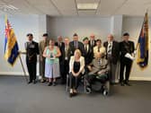 Pam Gilligan, from Compassion in Action, with veterans from the Wigan borough
