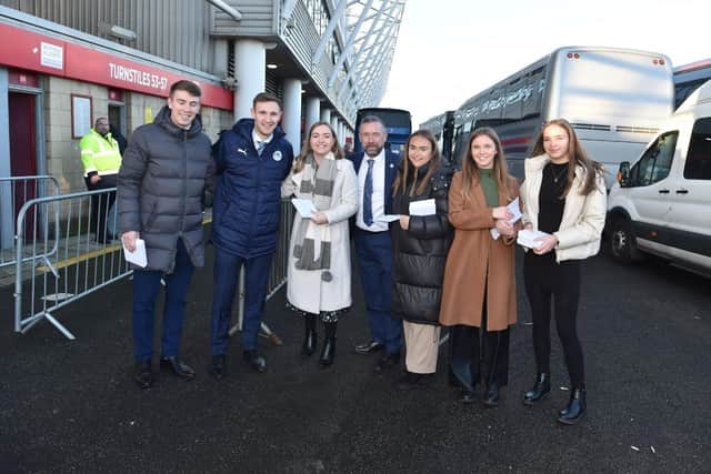 Latics CEO Mal Brannigan and club secretary Sarah Guilfoyle spread festive cheer at Middlesbrough