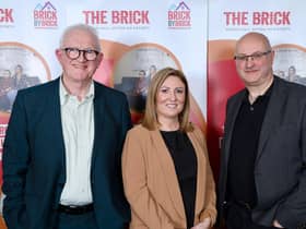 The Brick's CEO Keely Dalfen, centre, with outgoing chairman of trustees Dr John Parker , left, and the new chairman Dr Paul Plant