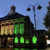 Leigh Town Hall lit up in the colours of Black History Month