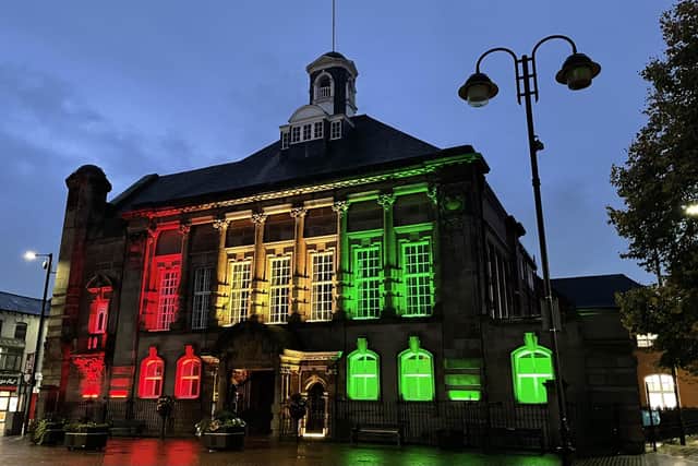Leigh Town Hall lit up in the colours of Black History Month