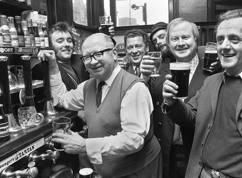 Landlord Colin Cook and regulars at the Market Hotel in Wigan in 1974.