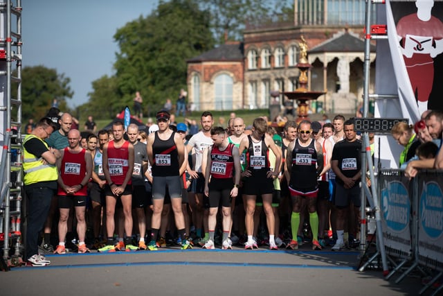 The 10th annual Wigan 10k, Mesnes Park Wigan. Pictured; Competitors and spectators observe a one minute silence followed by the natonal anthem, in memory of the Queen.