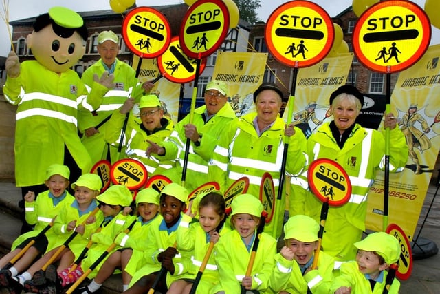 Lollipops galore in Wigan town centre as regular crossing patrol men and women are joined by little lollipopers from St. Mary's and St. John's RC Primary School.