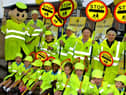 Lollipops galore in Wigan town centre as regular crossing patrol men and women are joined by little lollipopers from St. Mary's and St. John's RC Primary School.