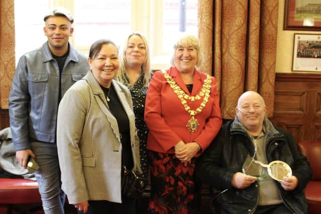 Dave Grundy collects the award from the Mayor of Wigan Coun Marie Morgan