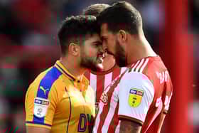 Sam Morsy gets his point across during his time with Latics