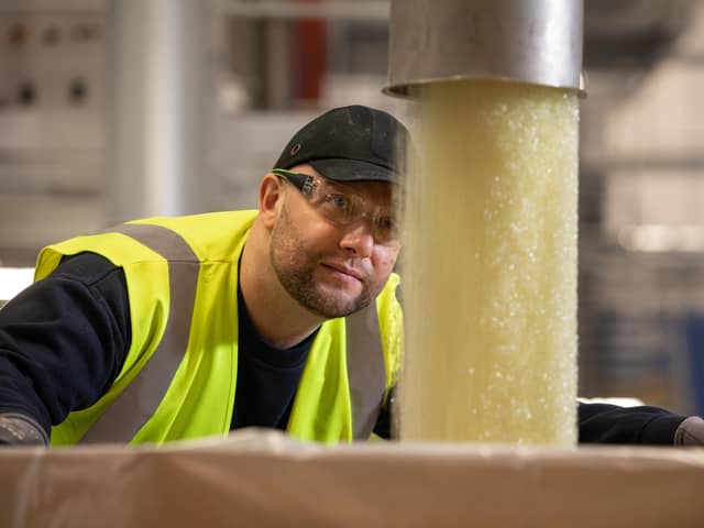 Aquapak worker in factory.