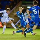 Will Goodwin shoots for goal for Latics