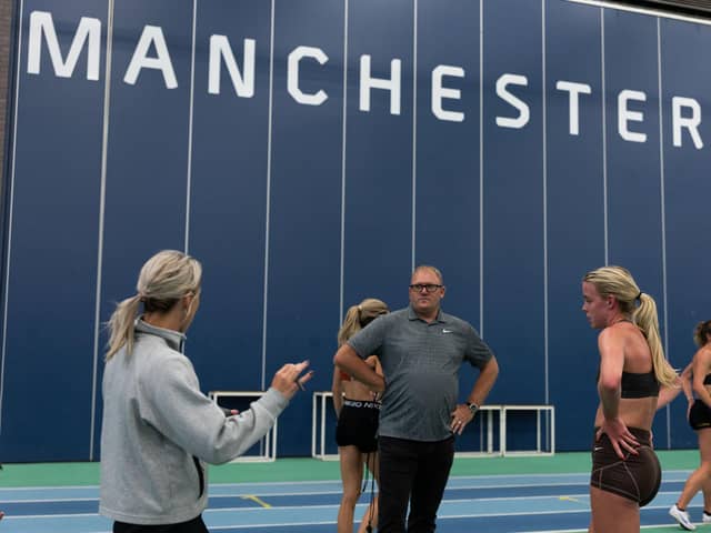 Keely Hodgkinson has a chat with coaches Jenny Meadows and Trevor Painter during a training session at Sport City, Manchester
