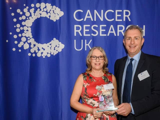 Carolyn Cross with Cancer Research UK's director of fund-raising Simon Ledsham