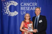 Carolyn Cross with Cancer Research UK's director of fund-raising Simon Ledsham
