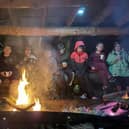 The Scouts trying to keep warm in front of the fire