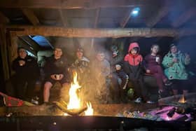 The Scouts trying to keep warm in front of the fire