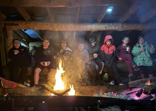 The Scouts trying to keep warm in front of the fire