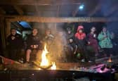 The Scouts trying to keep warm in front of the fire