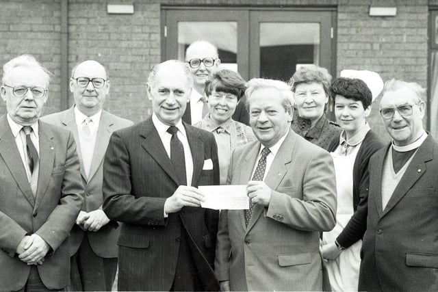 Wigan Masons present a cheque to Wigan and Leigh Hospice in 1989