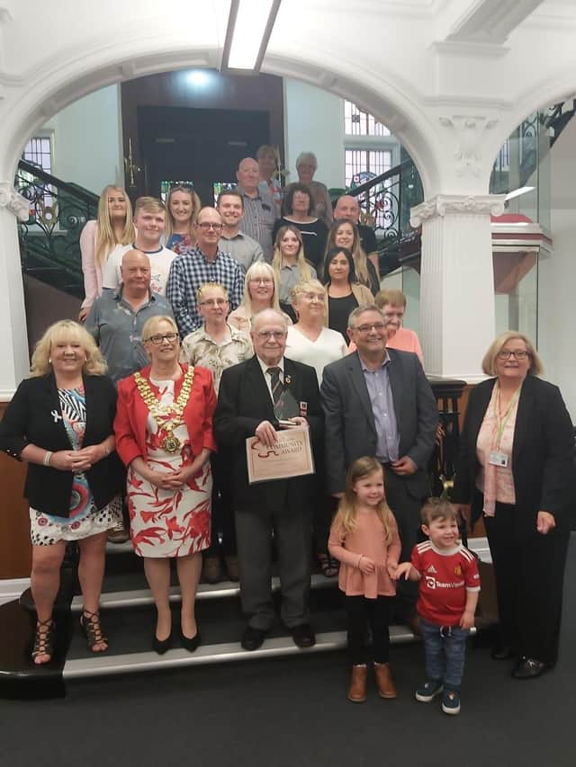 Friends and family of Derek Green surprised him at Wigan Town Hall as he was presented with the Heart of the Community Award