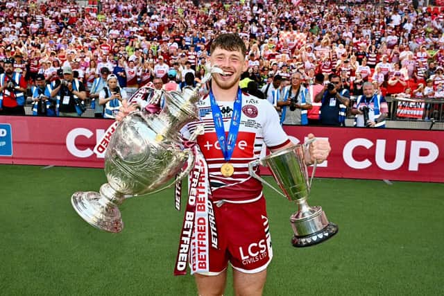 Jack Farrimond shows off the Challenge Cup and the Lance Todd Trophy