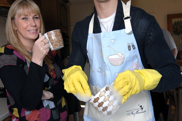 Wigan Athletic star Paul Scharner does the washing up for Karen Wiseman, from Ashton, for Mother's Day