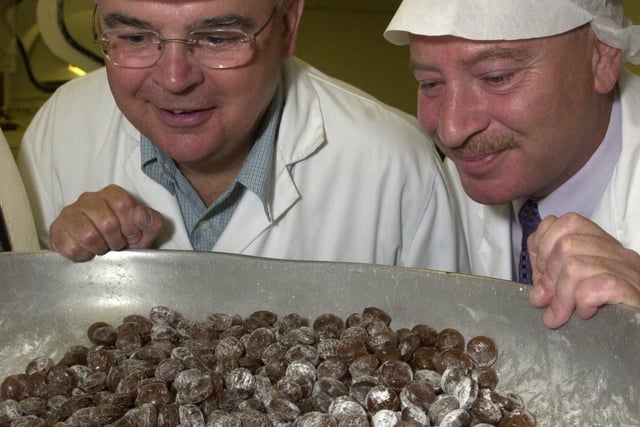 Terry Wynn MEP gets to sample the Uncle Joe's Mint Balls straight off the production line during his visit to William Santus & Co, to talk about the Euro and exports (and rugby and football!), with joint managing director Antony Winnard,