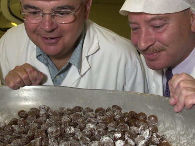 Terry Wynn MEP gets to sample the Uncle Joe's Mint Balls straight off the production line during his visit to William Santus & Co, to talk about the Euro and exports (and rugby and football!), with joint managing director Antony Winnard,