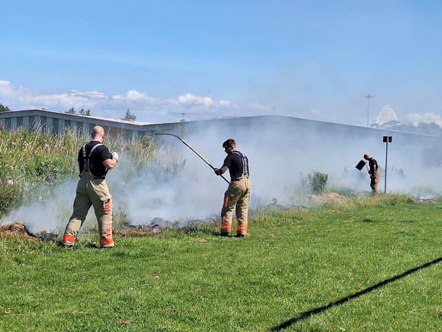 Firefighters tackling a blaze at the pitches on Scot Lane