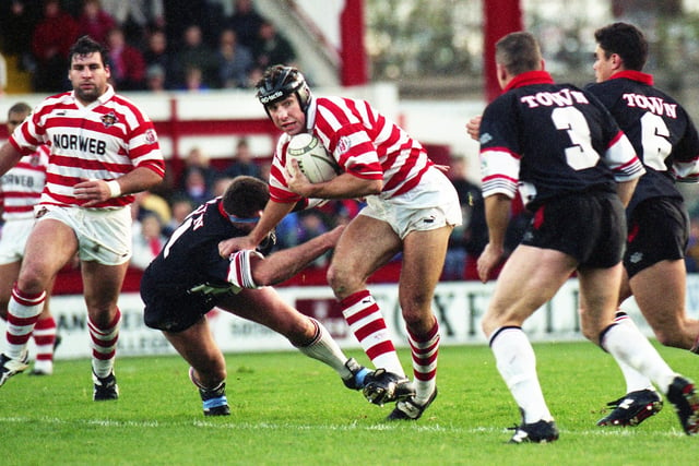 Wigan forward Andy Johnson evades a tackle against Workington Town in a league match at Central Park on Sunday 19th of November 1995.
Wigan won 44-20. 