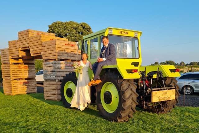 Newlyweds Chris and Susan with the tractor