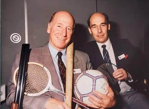 Chris Kerr (right) with former Manchester United footballer Bobby Charlton before he turned to writing