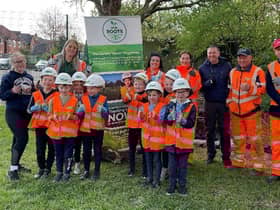 Lowton St Luke's Primary School pupils taking part in the planting activity with some of the Murphy team