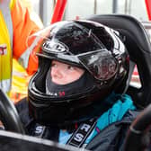 A youngster is fitted for her ride in a kart at Three Sisters circuit for the Speed of Sight fun day