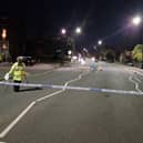 Wigan Lane this evening. A damaged motorbike remains in the middle of the road