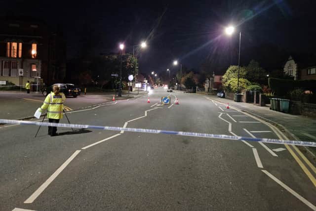 Wigan Lane this evening. A damaged motorbike remains in the middle of the road